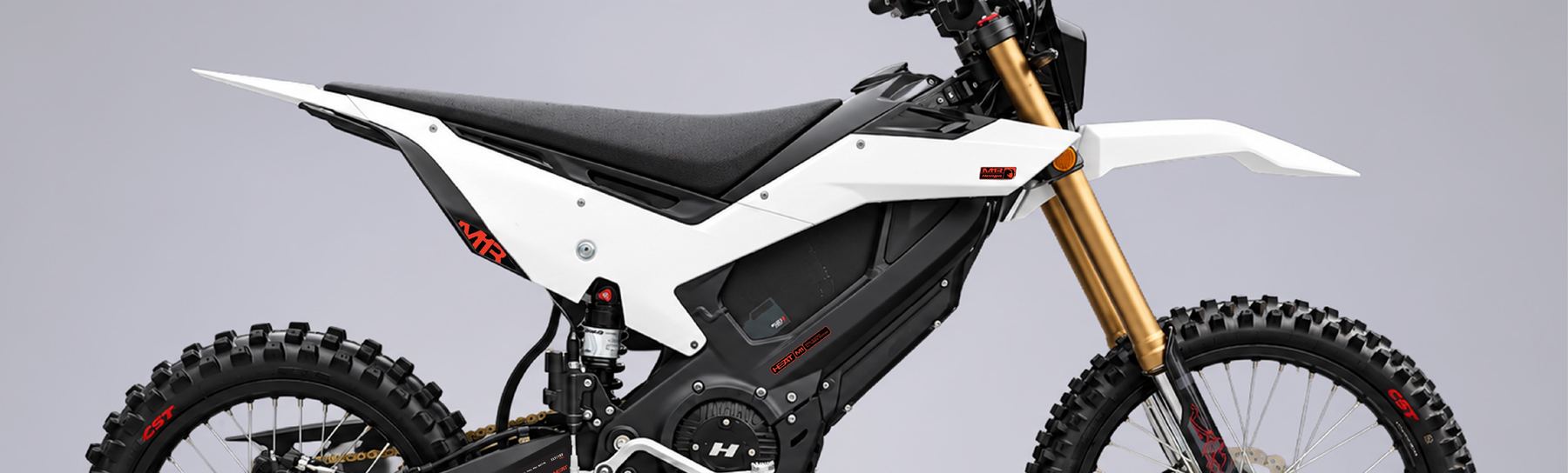 M1 Series electric dirt bike in white and black with gold forks